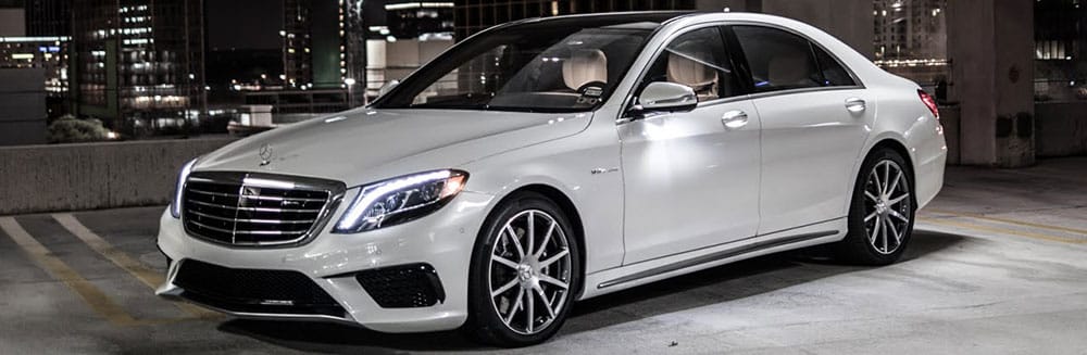 Mercedes Benz repair - white mercedes parked in a parking garage at night